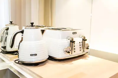 two white toasters sitting on top of a counter at Residence Glamour Excellent in Prague