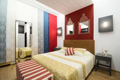 a bedroom with a bed and a mirror at Luxury apartments Pricna in Prague