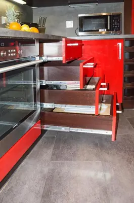 a kitchen with a red cabinet and a microwave at Luxury apartments Pricna in Prague