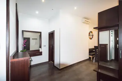 a hallway with a mirror and a dressing room at Luxury apartments Pricna in Prague