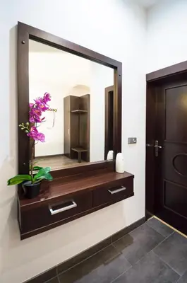 a large mirror on a wall in a bathroom at Luxury apartments Pricna in Prague