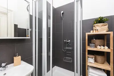 a bathroom with a shower and a sink at Chill apartments in Prague