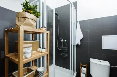 a bathroom with a shower stall and a toilet at Chill apartments in Prague