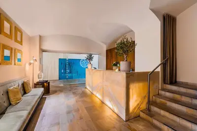 a hotel room with a desk and a bed at NH Collection Prague Carlo IV in Prague