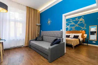 a living room with a couch and a bed at Residence Vaclavska in Prague