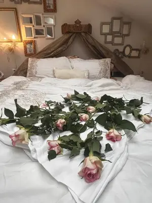 a bunch of roses laying on a bed at Imperial Rezidence in Prague