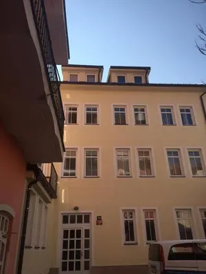 a large white building with a lot of windows at Imperial Rezidence in Prague