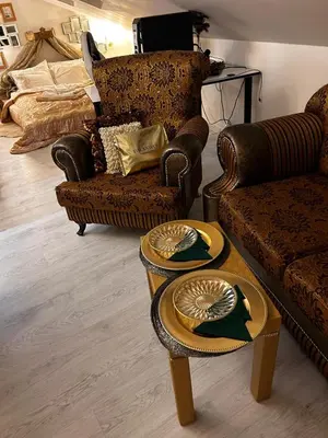 a living room with two couches and two tables at Imperial Rezidence in Prague