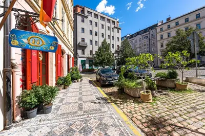 a cobblestone street in a city with buildings at Wishlist Prague Residences - Old Town Square in Prague
