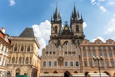 an old building with two towers on top of it at Wishlist Prague Residences - Old Town Bilkova in Prague