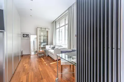 a living room with a couch and a table at Wishlist Prague Residences - Old Town Bilkova in Prague
