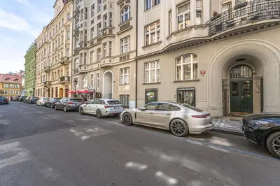 a row of cars parked in front of buildings at Wishlist Prague Residences - Old Town Bilkova in Prague