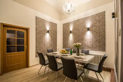 a dining room with a table and chairs at 4BDR Historical Spirit Apt by Ruterra in Prague