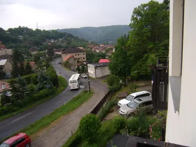 a view of a city with cars parked on a street at Penzion Lida in Srbsko