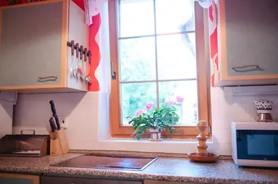 a kitchen counter with a window and a sink at Bydleni u Babicky in Bratronice