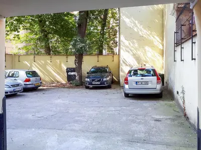 a group of cars parked in a parking lot at Duskova Apartments in Prague
