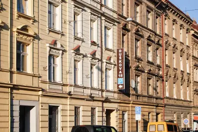 a building with a street sign in front of it at Duskova Apartments in Prague