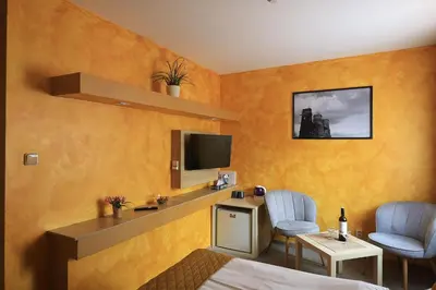 a hotel room with a bed and a window at U Admirala in Kladno