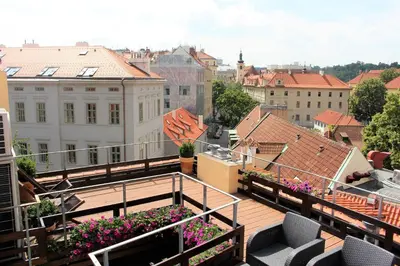 a balcony with a view of a city at Agnes - Apartments in Prague