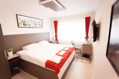 a hotel room with a bed and a window at Villa Royal in Prague
