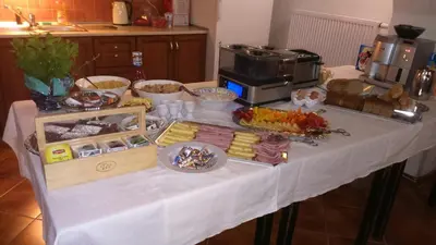 a table with a buffet of food on it at Apartmány V Podzámčí II. in Mělník