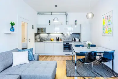 a living room with a couch and a table at Baranova Apartments in Prague