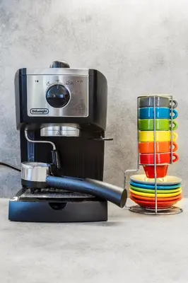 a coffee maker with a cup on a table at Baranova Apartments in Prague