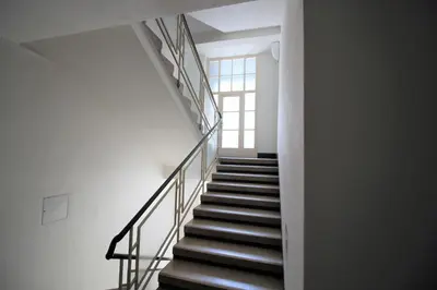 a staircase in a building with a window at Agnes - Romance in city II. in Prague