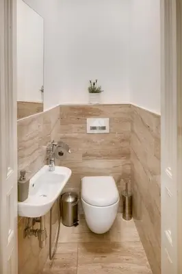 a bathroom with a toilet and a sink at Smetanovo nábřeží - Riverview Old Town Apartment in Prague