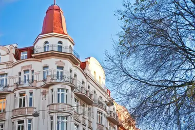 a tall building with a tower on top of it at Bear Fountain Residence in Prague