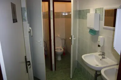 a small bathroom with a toilet and a sink at Sporthotel BK Pod Lipou in Roudnice nad Labem