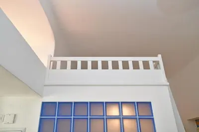 a room with a white ceiling with windows at Lovely little cosy Apt in Prague in Prague