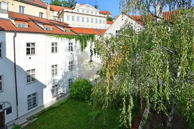 a view from the roof of a building with a tree at Lovely little cosy Apt in Prague in Prague