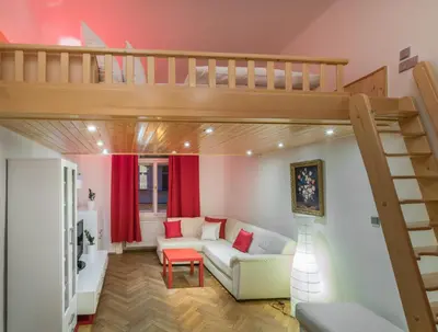 a living room with a loft bed and a couch at Mordecai 12 Apartments by Adrez in Prague