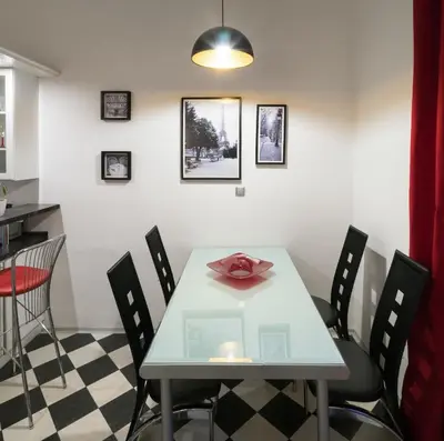 a dining room with a table and chairs at Mordecai 12 Apartments by Adrez in Prague