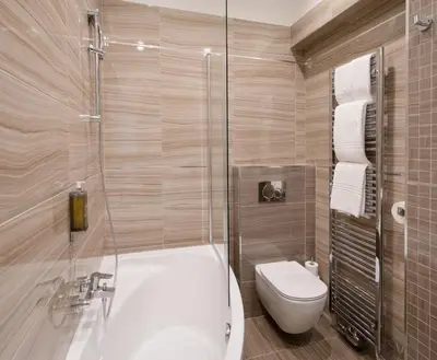 a bathroom with a tub and a toilet and a shower at Mordecai 12 Apartments by Adrez in Prague