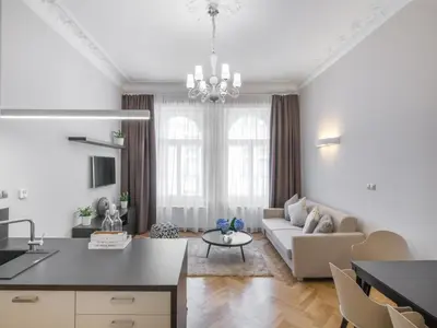 a living room with a couch and a table at Mordecai 12 Apartments by Adrez in Prague