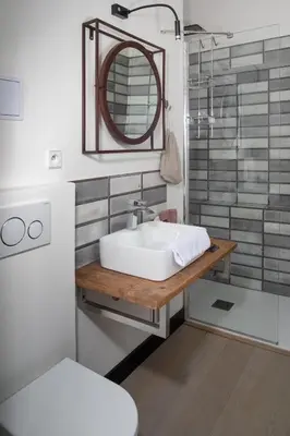 a bathroom with a white sink and a mirror at Antik Hotel Prague in Prague