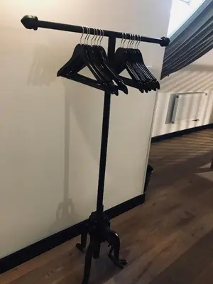 a black stand with umbrellas on top of it at Antik Hotel Prague in Prague