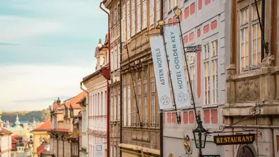 a group of buildings on a city street at Hotel Golden Key Prague Castle in Prague