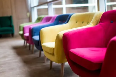a row of chairs lined up in a row at Friday Hotel in Prague