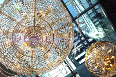 a bunch of chandeliers hanging from a ceiling at Friday Hotel in Prague