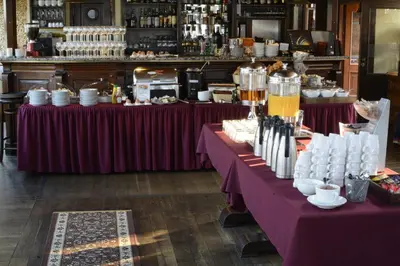 a table with purple table cloths and a bar at Boat Hotel Matylda in Prague