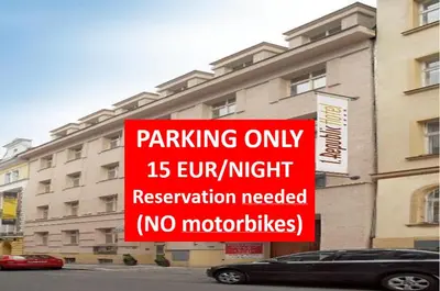 a red sign that reads parking only hour night reservation needed at 1.Republic Hotel in Prague
