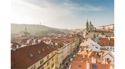 a view of a city with roofs and buildings at Mostecká 12 Residence in Prague