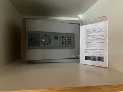 a microwave on a wall next to a sign at Dům Stašov in Stašov