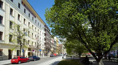 a street with cars parked on the side of the road at Clarion Hotel Prague City in Prague