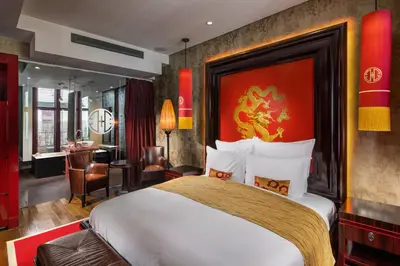 a bedroom with a large bed in a room at Buddha-Bar Hotel Prague in Prague