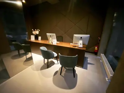 a room with a table with two computers on it at MOODs boutique hotel in Prague