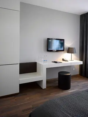 a room with a white desk with a tv on it at MOODs boutique hotel in Prague